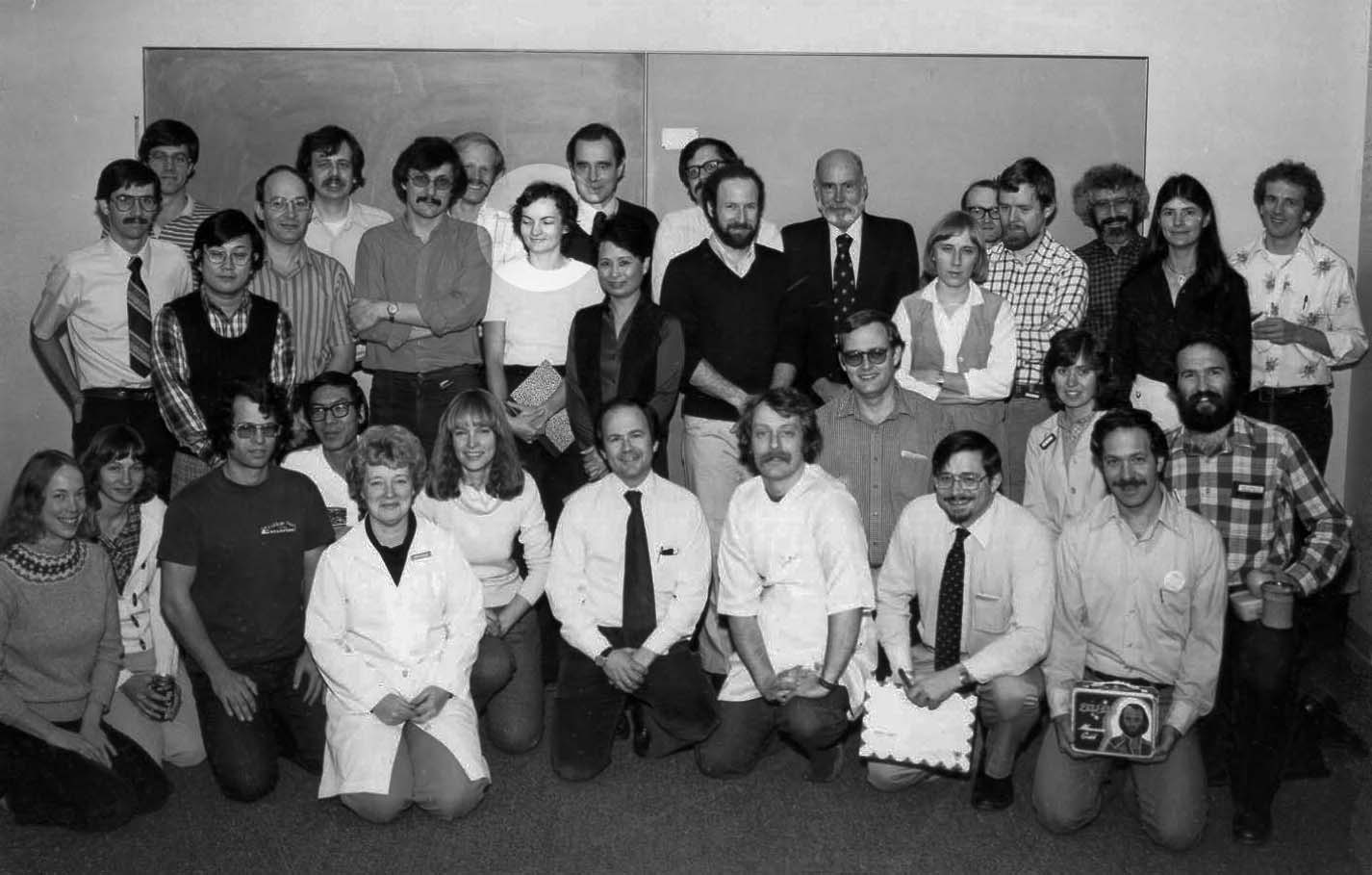 A black and white photo of researchers from 1980